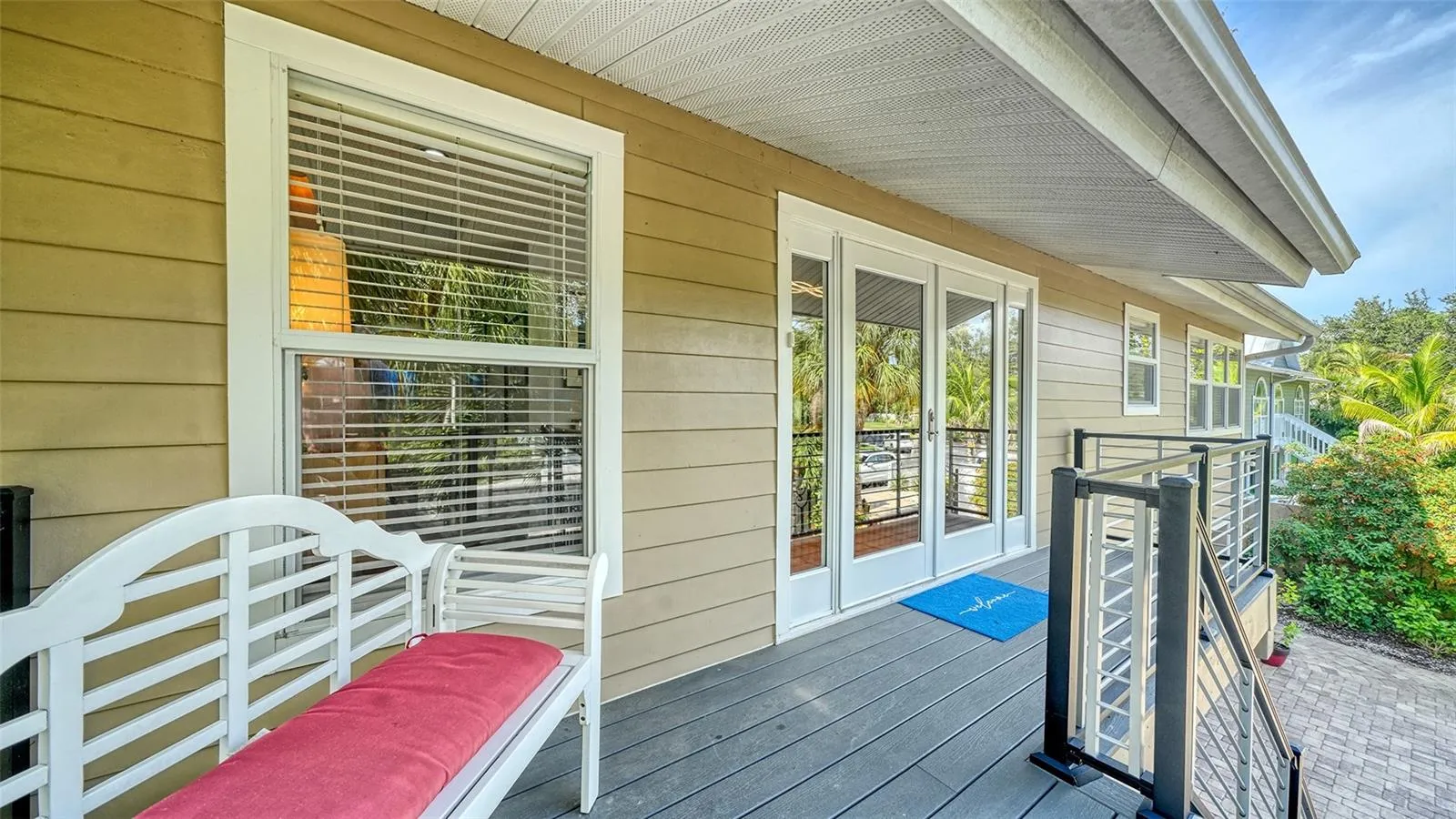 Welcoming covered front porch with composite decking.