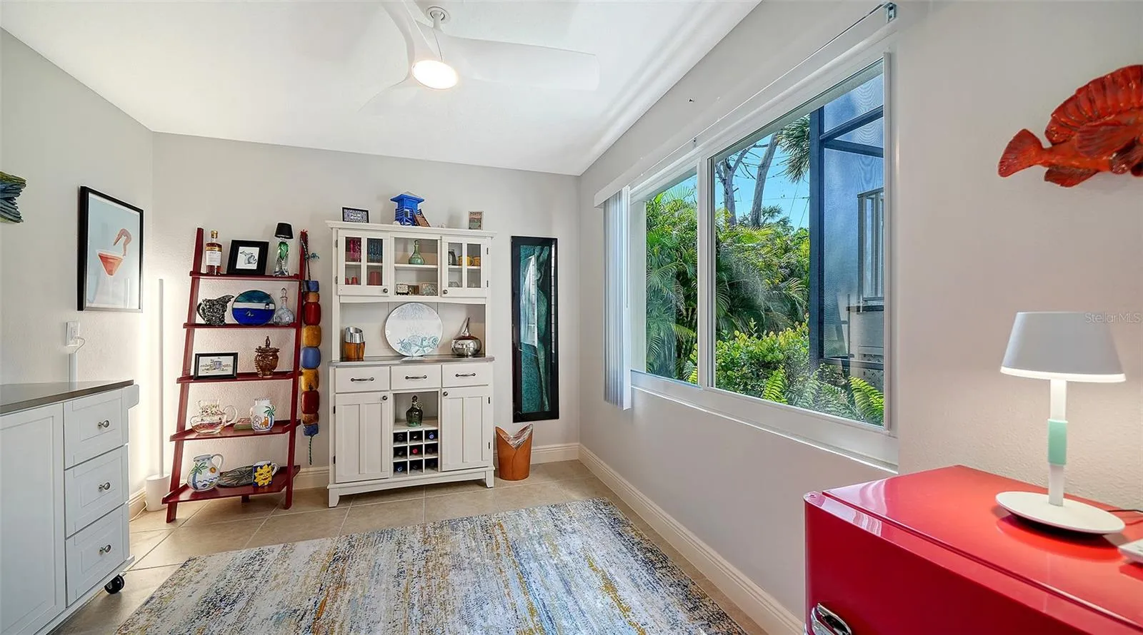Flexible lower-level office with built-in storage and natural light.