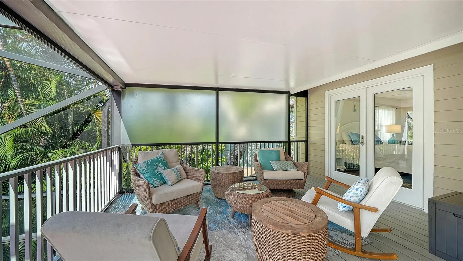 Private screened balcony off the primary suite.