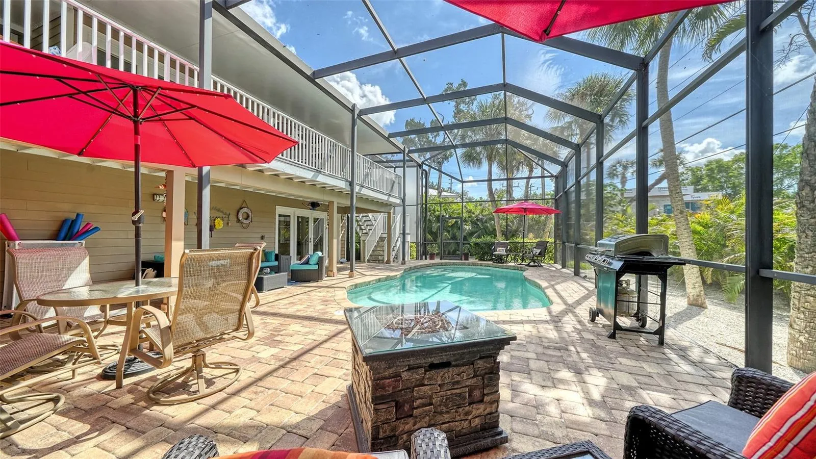 Expansive screened pool area with plenty of room for lounging and entertaining.