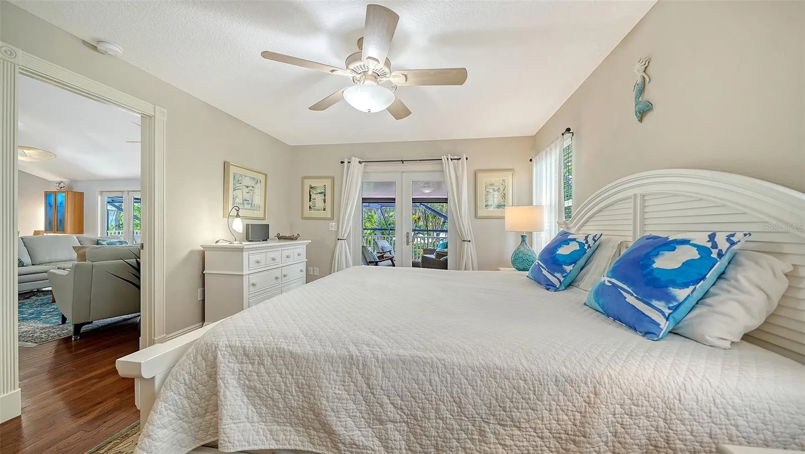 Light-filled primary bedroom with vaulted ceiling and generous proportions.