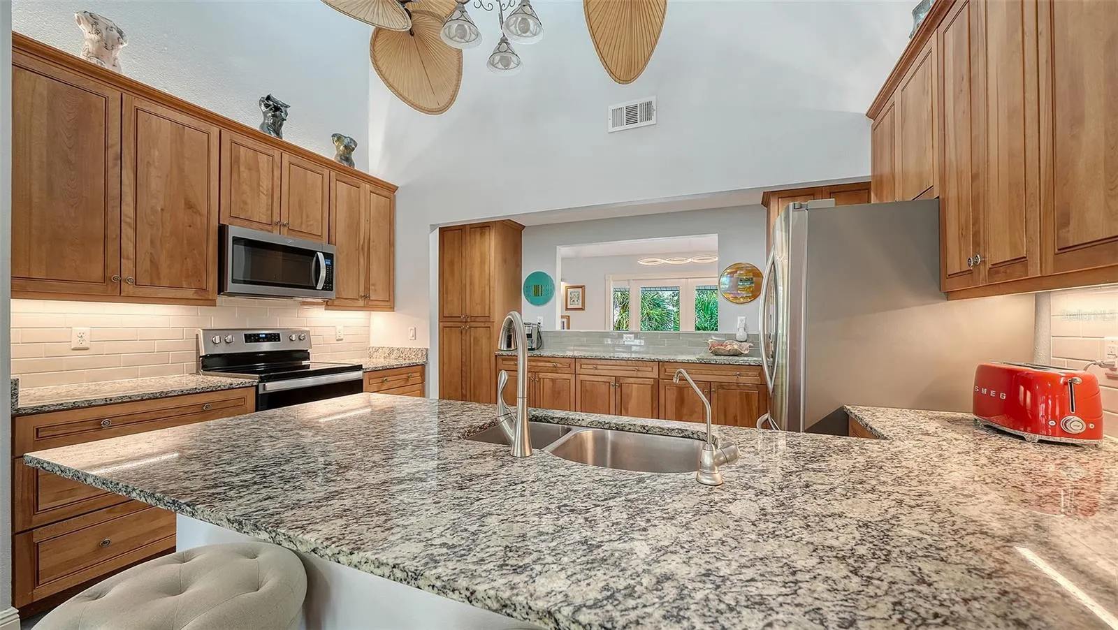 Remodeled kitchen with granite countertops, custom cabinetry and stainless steel appliances.