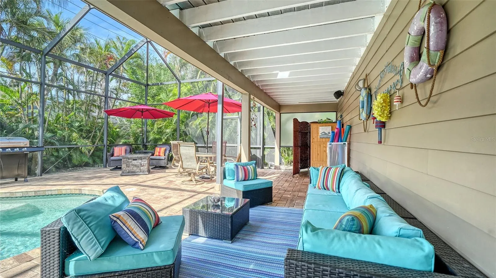 Covered poolside seating creates a comfortable shaded retreat.
