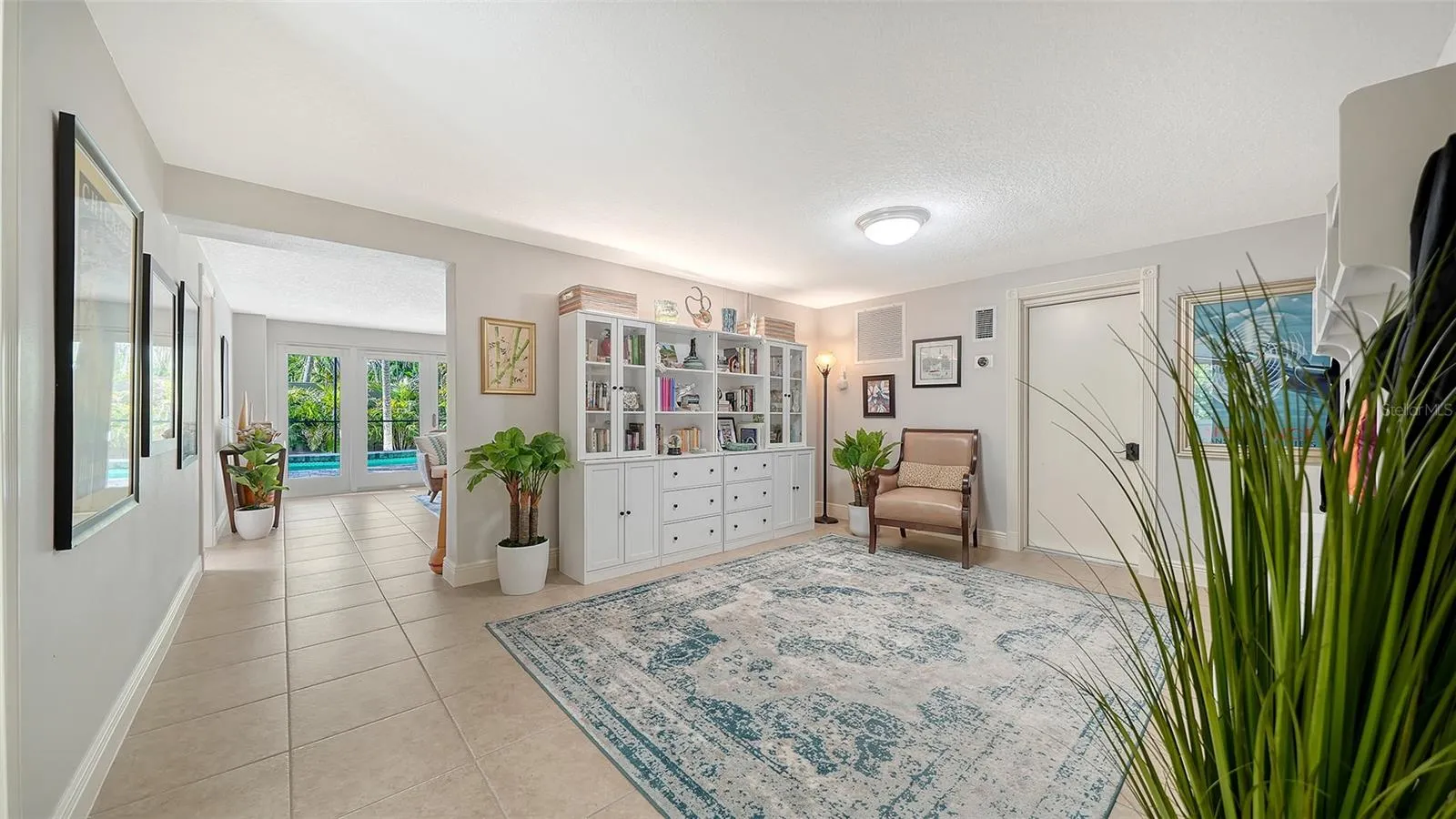 Expansive lower-level bonus space with built-in cabinetry and tremendous flexibility.