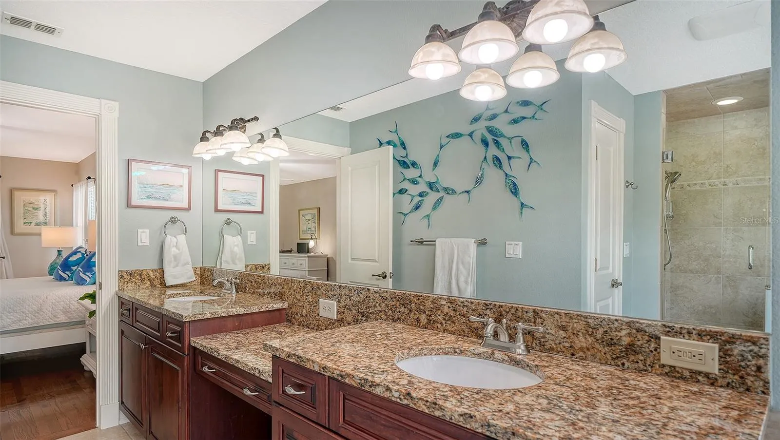 Dual vanity provides plenty of counter and storage space.