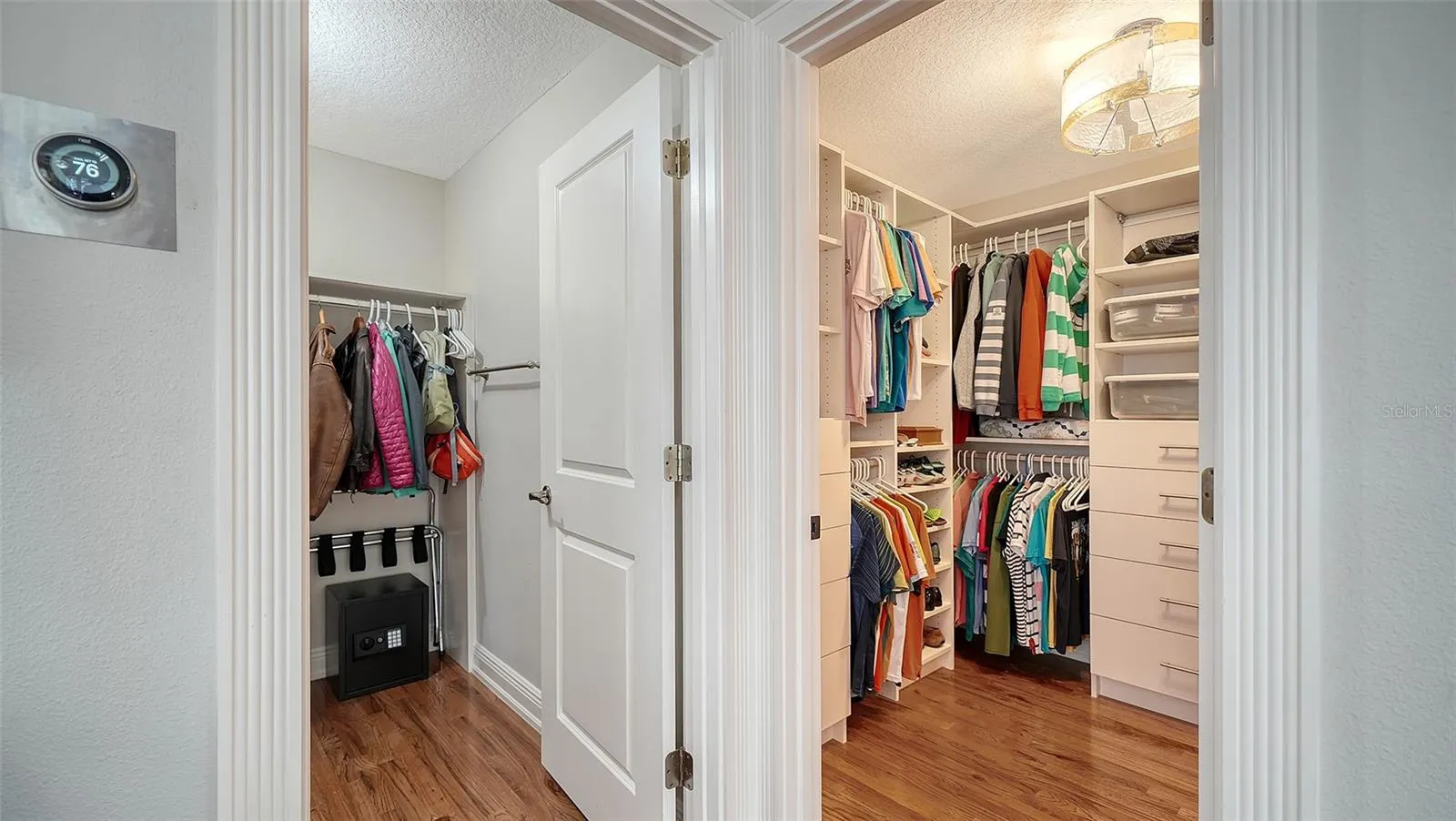 Thoughtfully redesigned walk-in closet with custom organization.