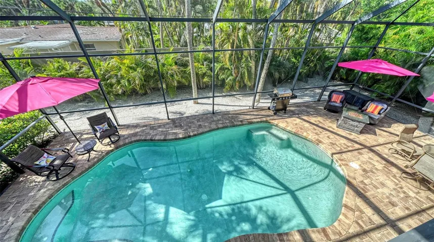 View of the heated saltwater pool from the elevated main living level.