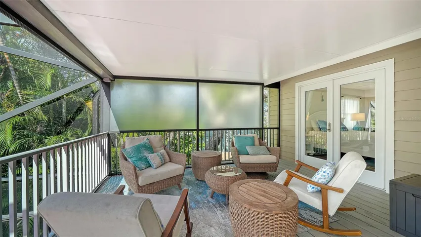 Private screened balcony off the primary suite.