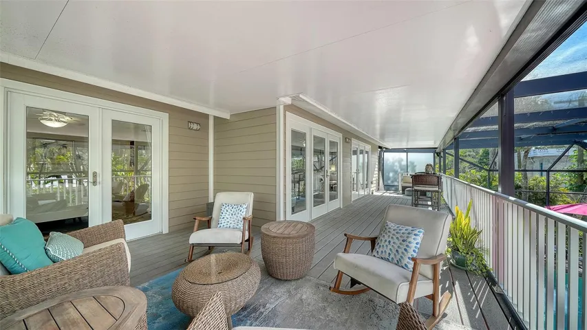 Additional view of the primary suite and its direct access to outdoor living space.