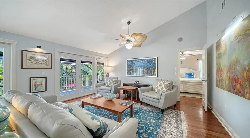 Bright and inviting main living area with vaulted ceilings and abundant natural light.