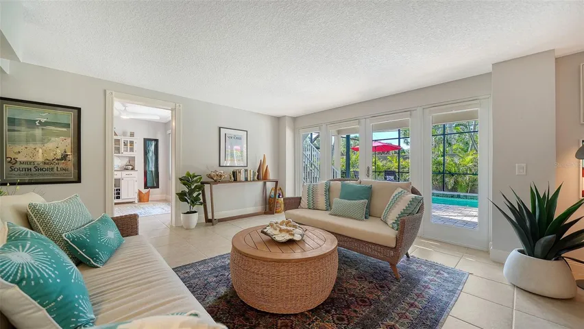 Spacious lower-level family room with French doors leading directly outside.