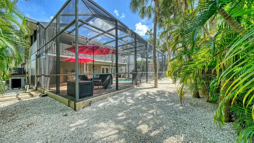 Spacious screened pool enclosure with resurfaced paver deck.
