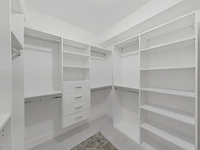 large closet with custom organizing