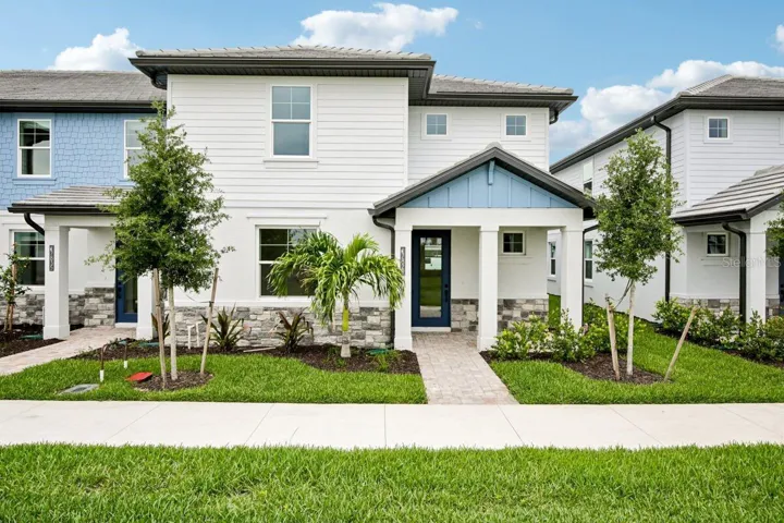Front Exterior-Photo description represents the model home of same floor plan.