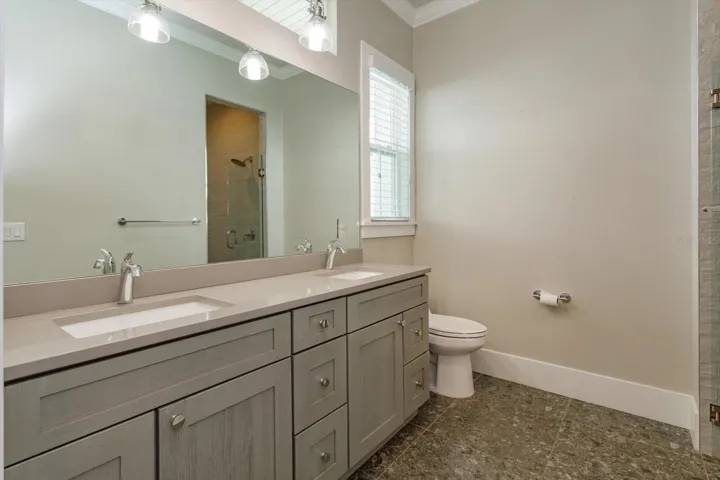 First floor study ensuite with dual sinks and shower