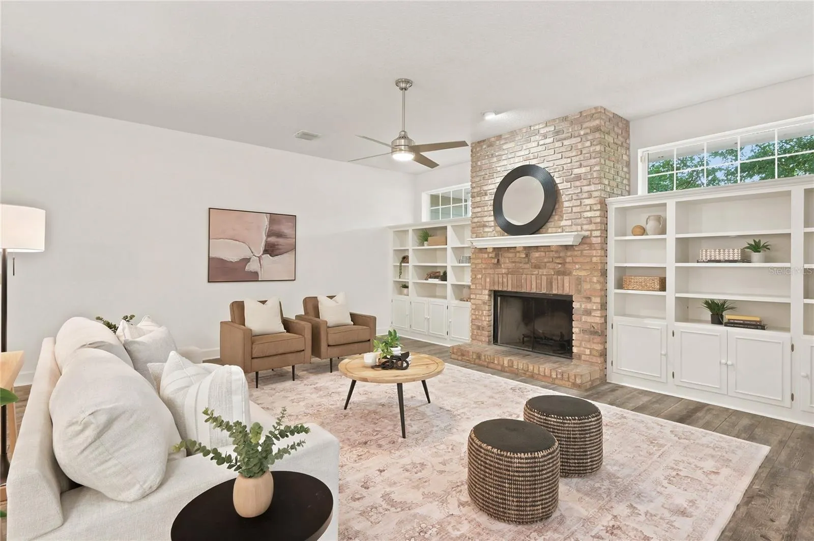 Clerestory windows draw natural light into the family room, enhancing the space with warmth &amp; an open, light-filled feel.
