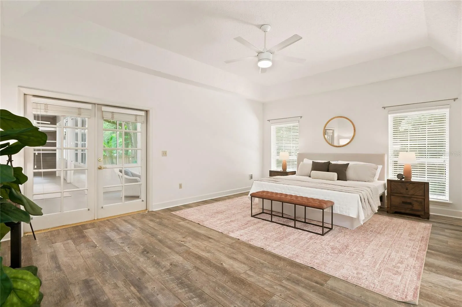 Privately positioned, the owners suite offers a tranquil retreat with tray ceilings and its own access to the enclosed porch
