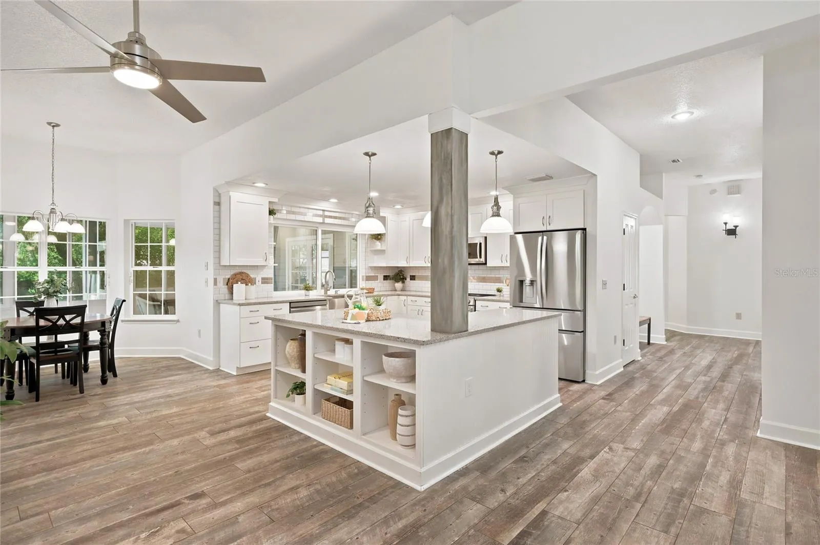 The open kitchen serves as the heart of the home, thoughtfully designed for everyday living and entertaining, with a generous center island adding both style and function.