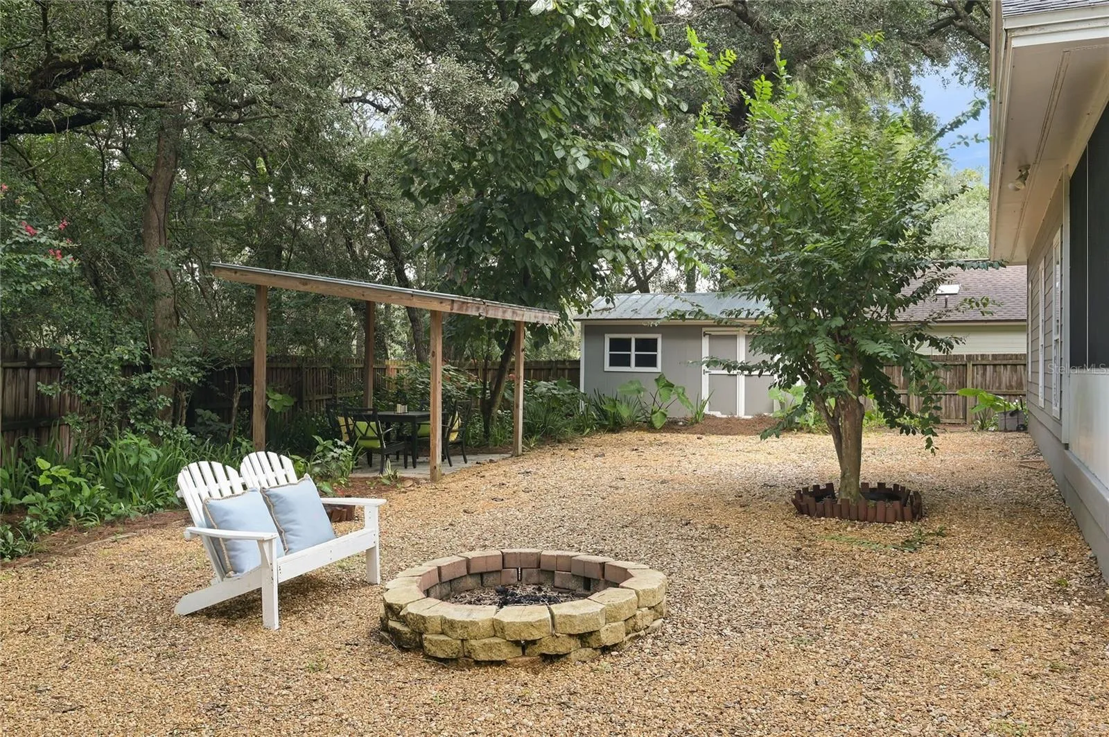 A charming fire pit creates an inviting gathering spot