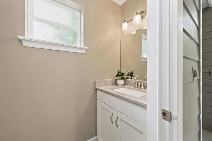 Second 1/2 bath located off the enclosed porch.