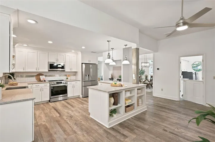 Island offers display shelves for favorite cookbooks or any other kitchen essentials