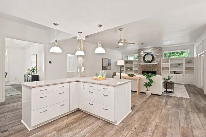 A spacious island that opens effortlessly to the adjoining living areas and offers additional storage and workspace.