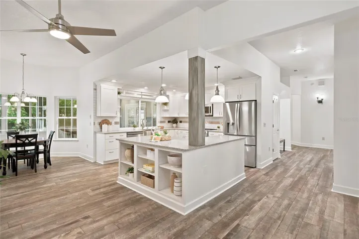 The open kitchen serves as the heart of the home, thoughtfully designed for everyday living and entertaining, with a generous center island adding both style and function.