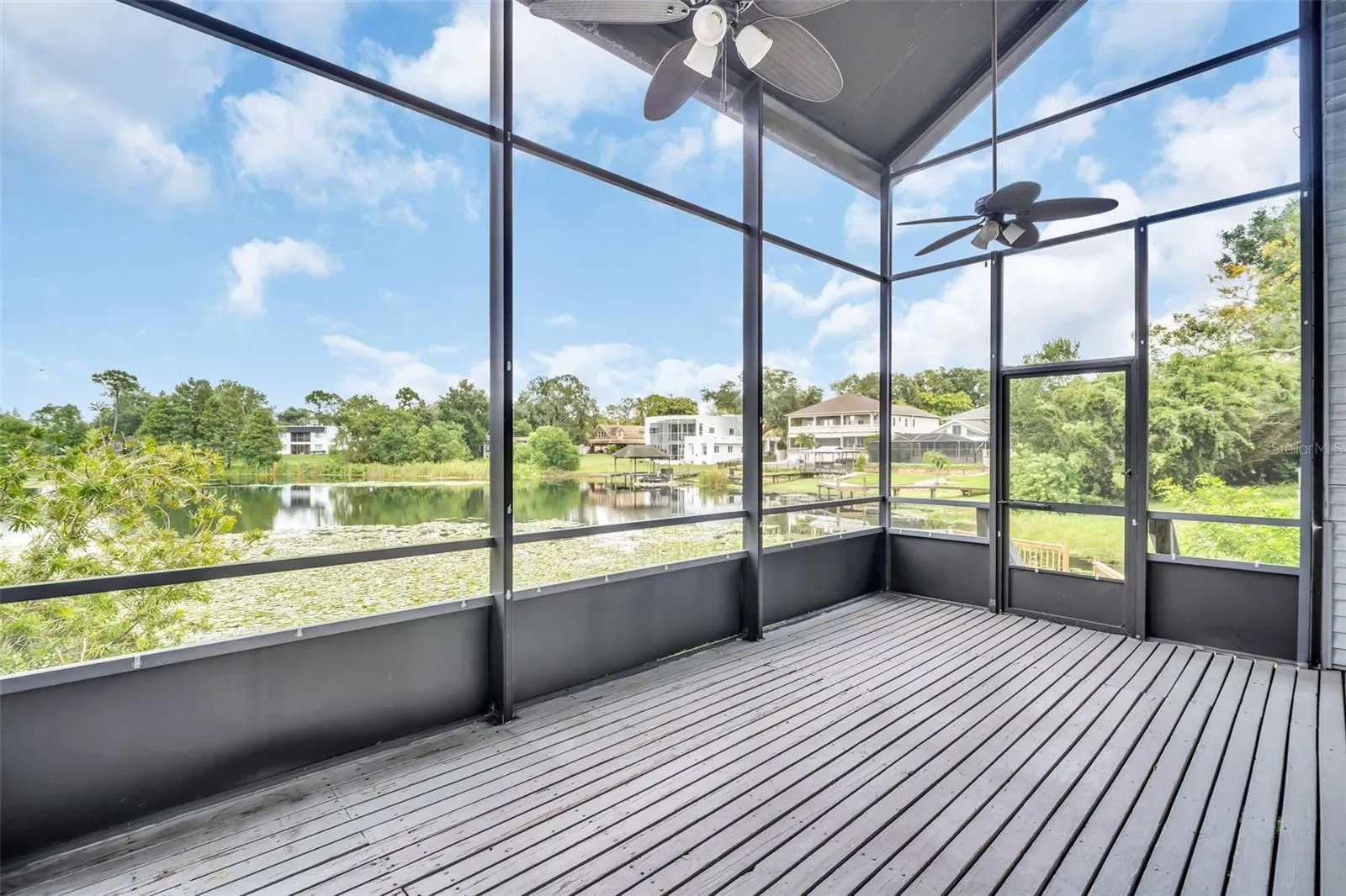 Back screened in patio overlooking Boot Lake