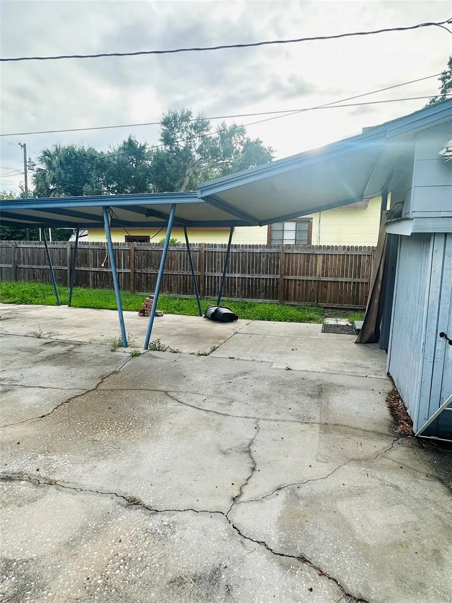 side view of carport at rear of house