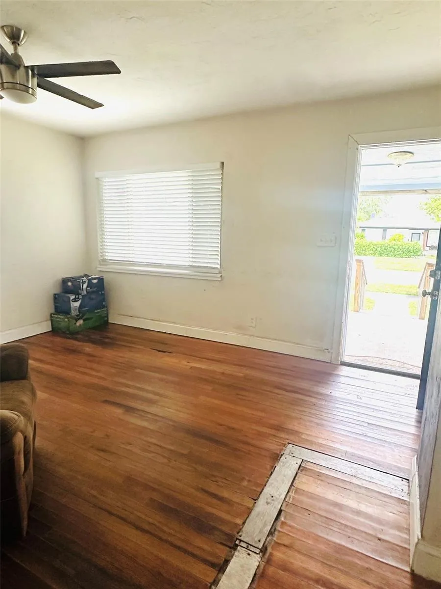 living room with front door open
