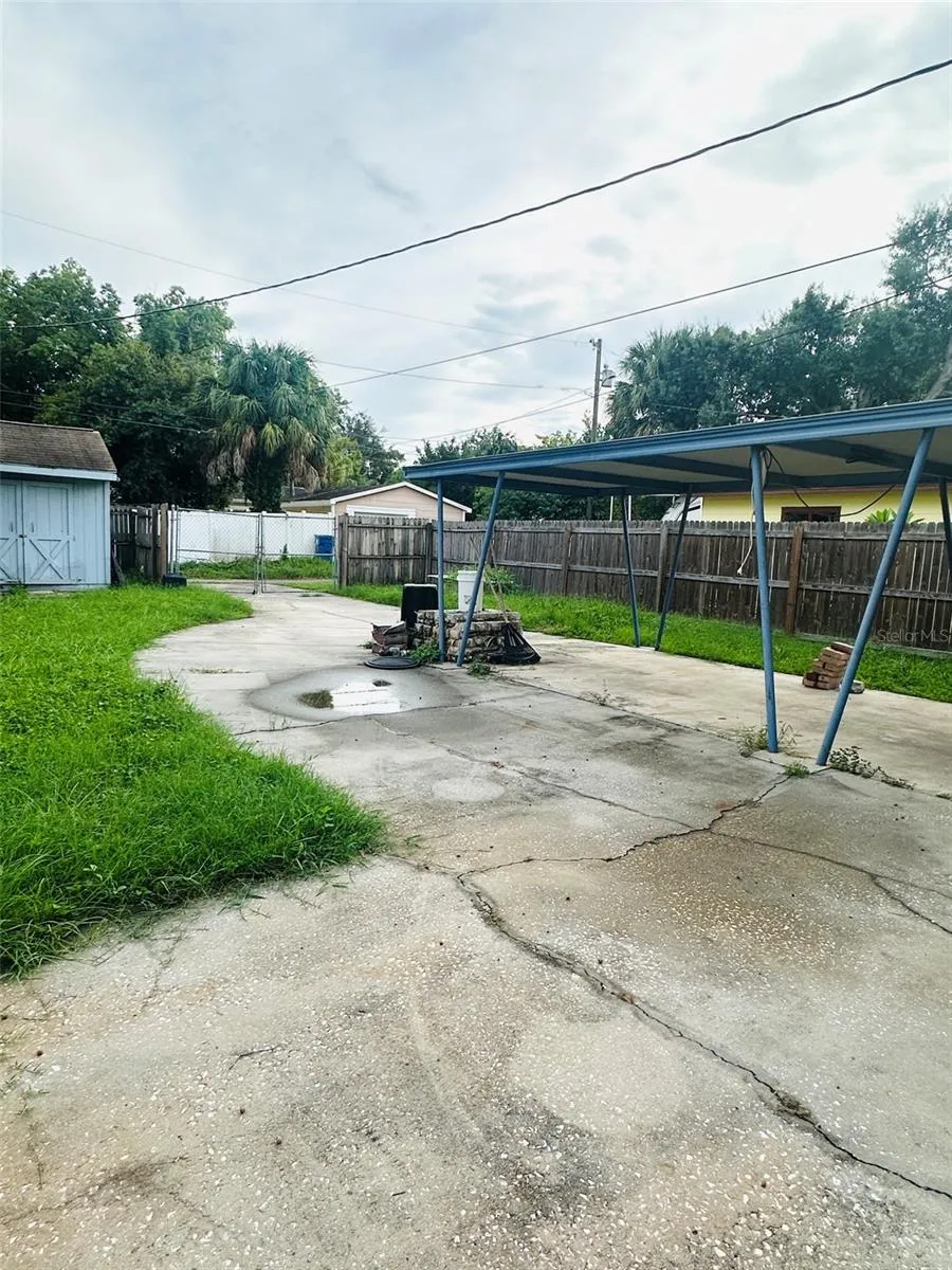 carport and backyard, alley access