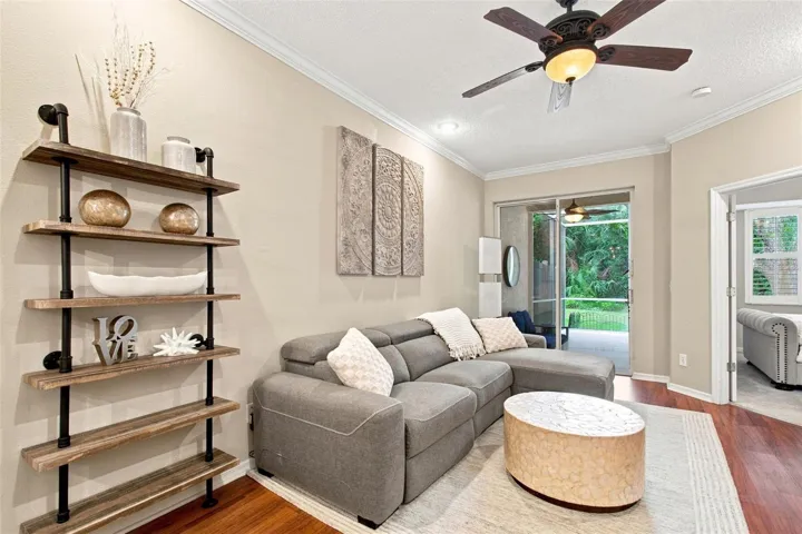 Family Room w/Luxury Vinyl Plank Flooring &amp; Sliding Glass Doors to Lanai