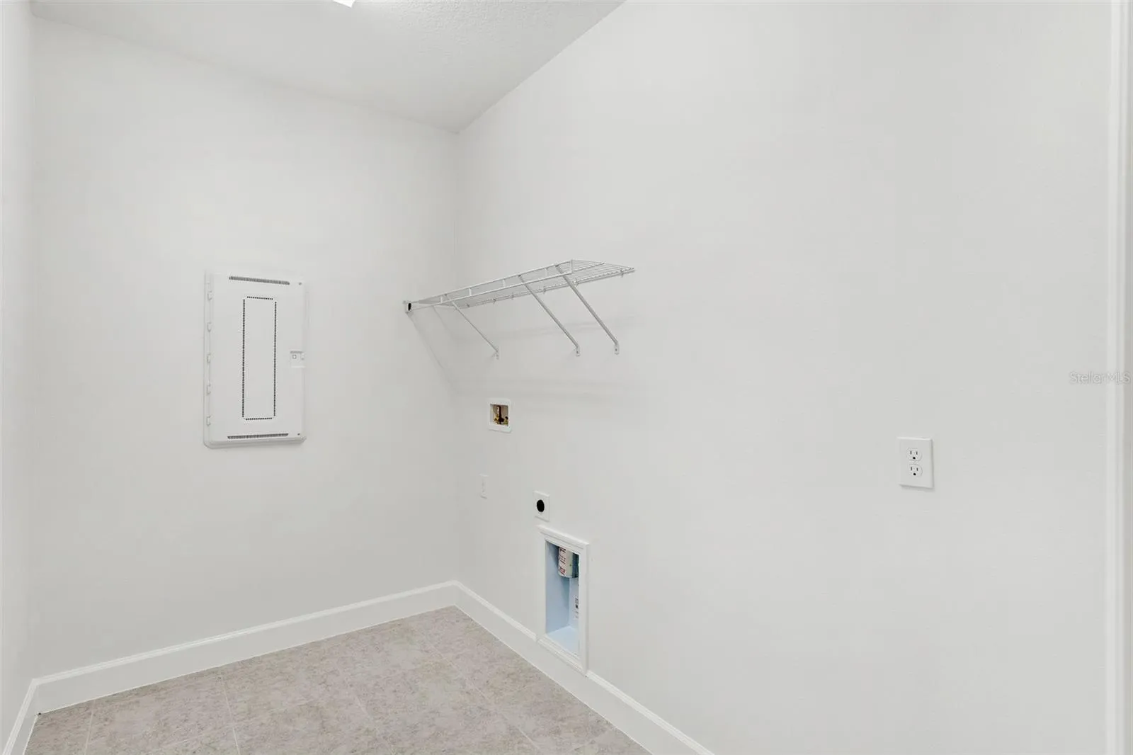 In home Laundry Room with washer and electric dryer hookups.