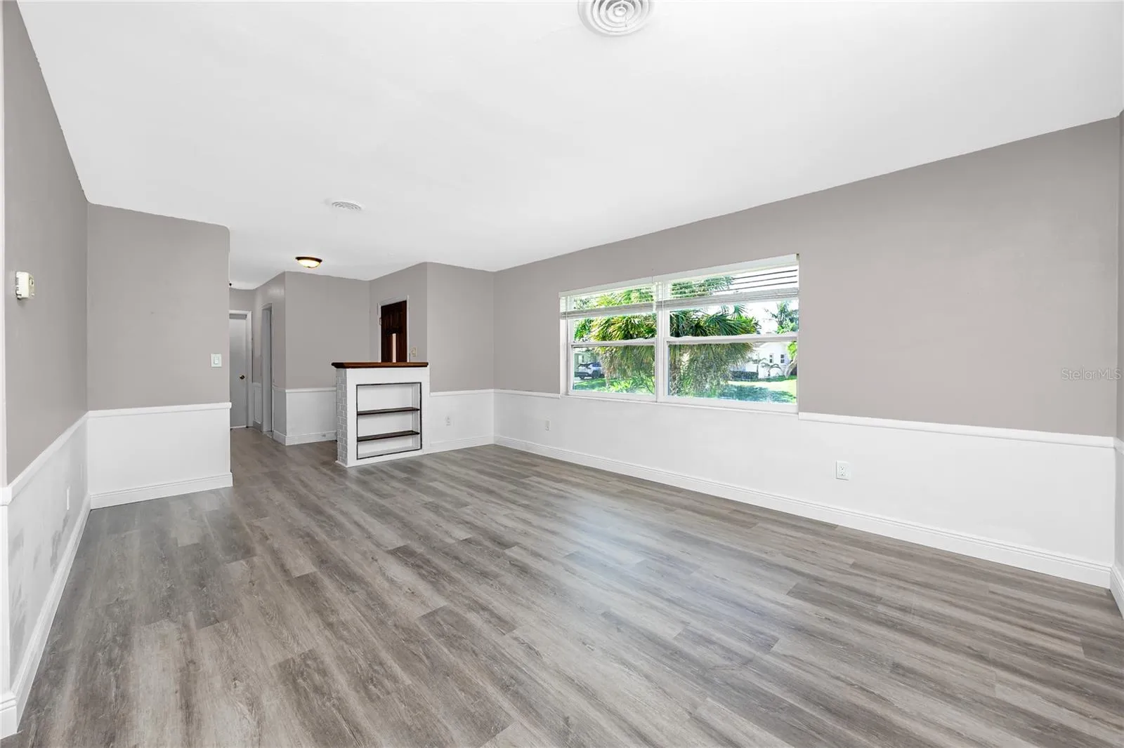 Family room with chair rail.