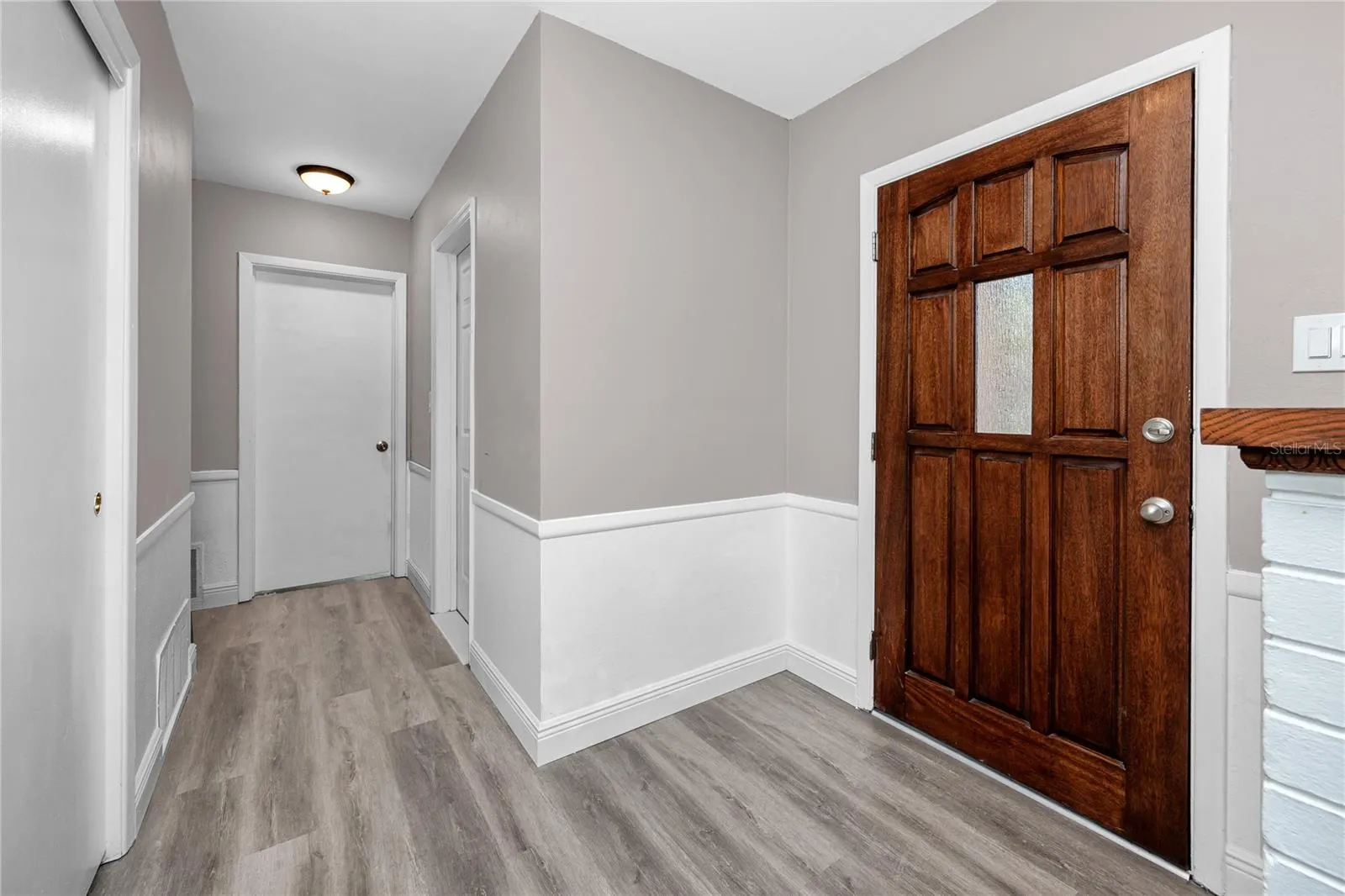 Front door with view to the bedroom.