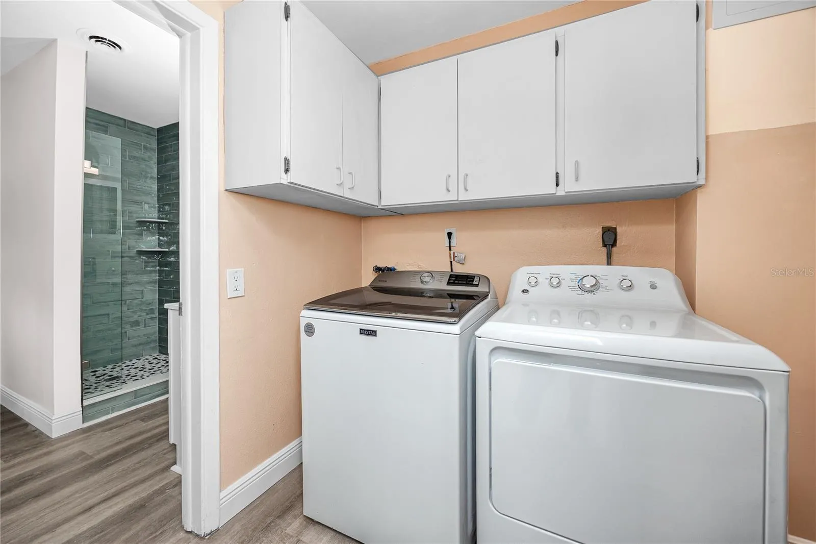 Laundry room with full size washer and dryer.