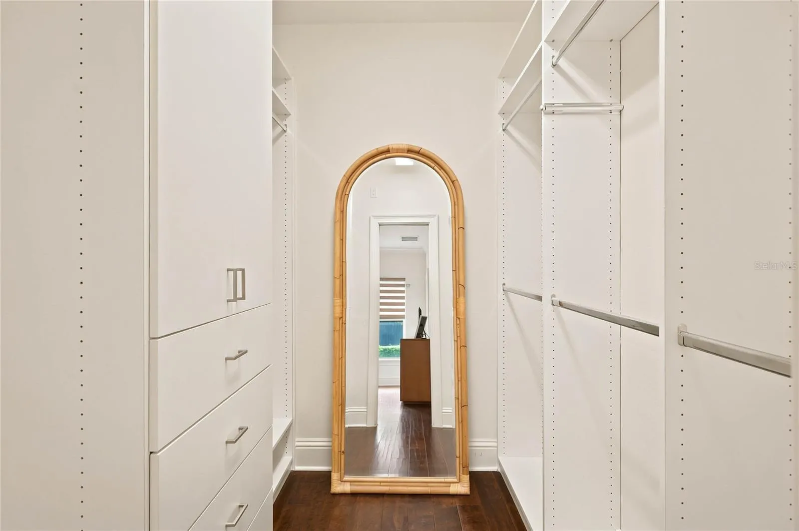 One of two walk-in customized closets in Owners suite
