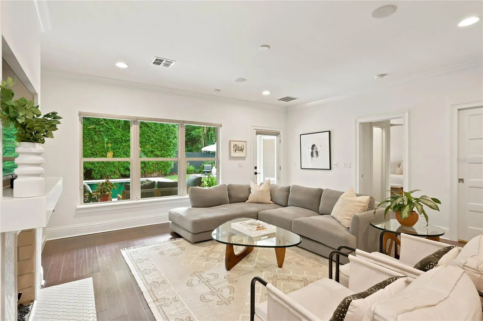 Family room overlooking verandah, pool and backyard