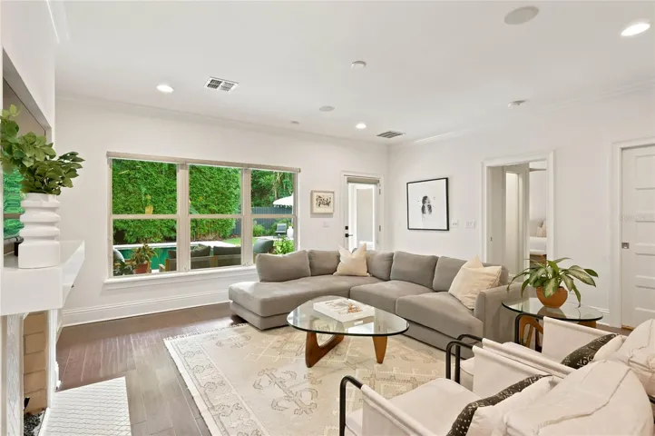 Family room overlooking verandah, pool and backyard