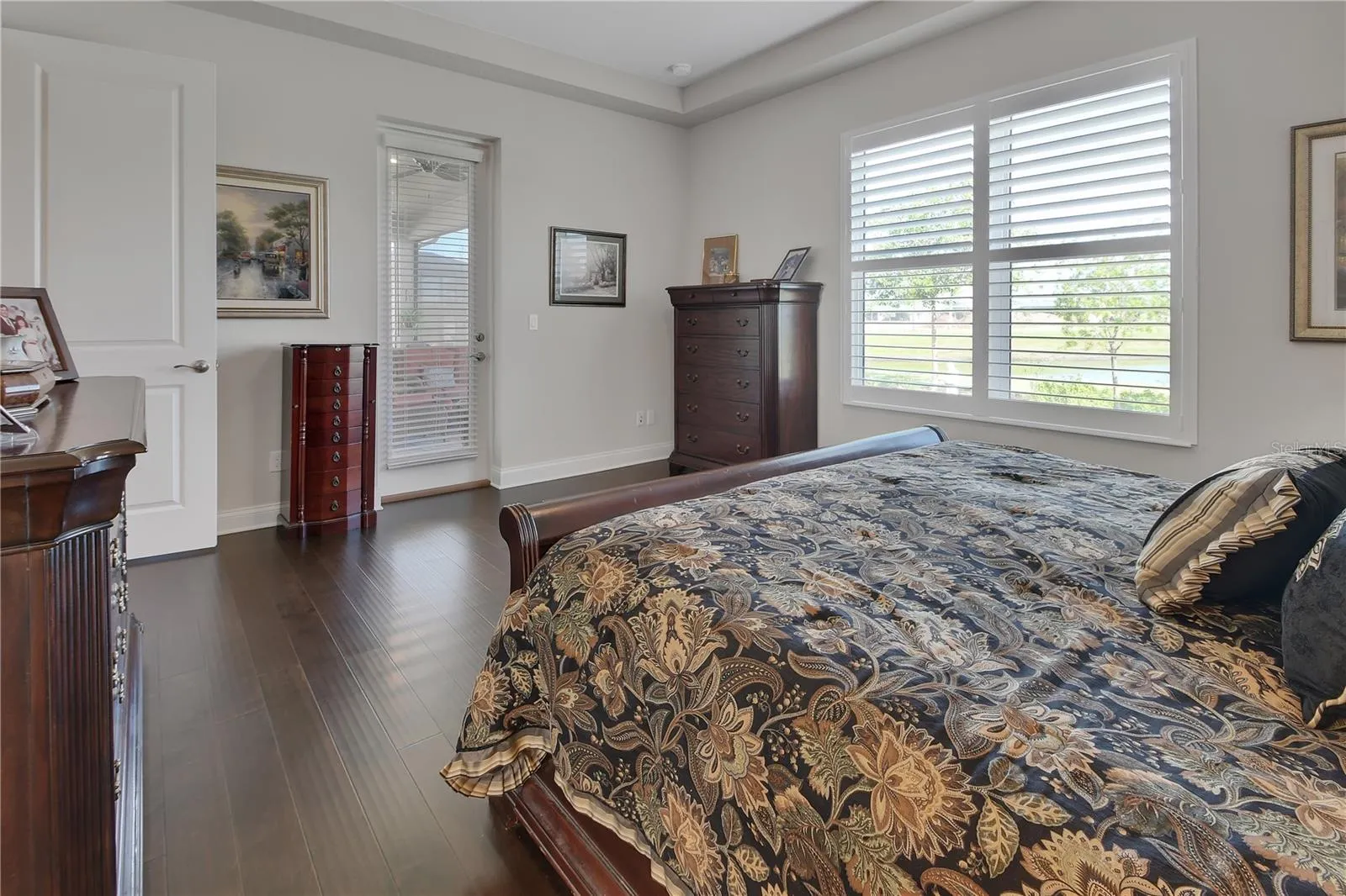 French door to lanai and view of pond from bedroom