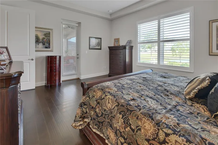 French door to lanai and view of pond from bedroom