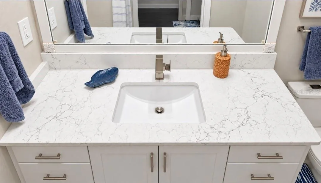 Quartz completes this look. modern sink, modern faucet and ergo height vanity