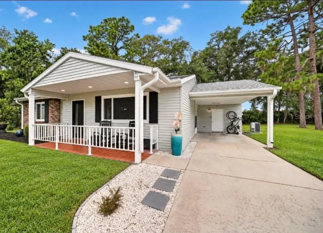 White rodk landscaping curb appeal bring charm all the way around the home.