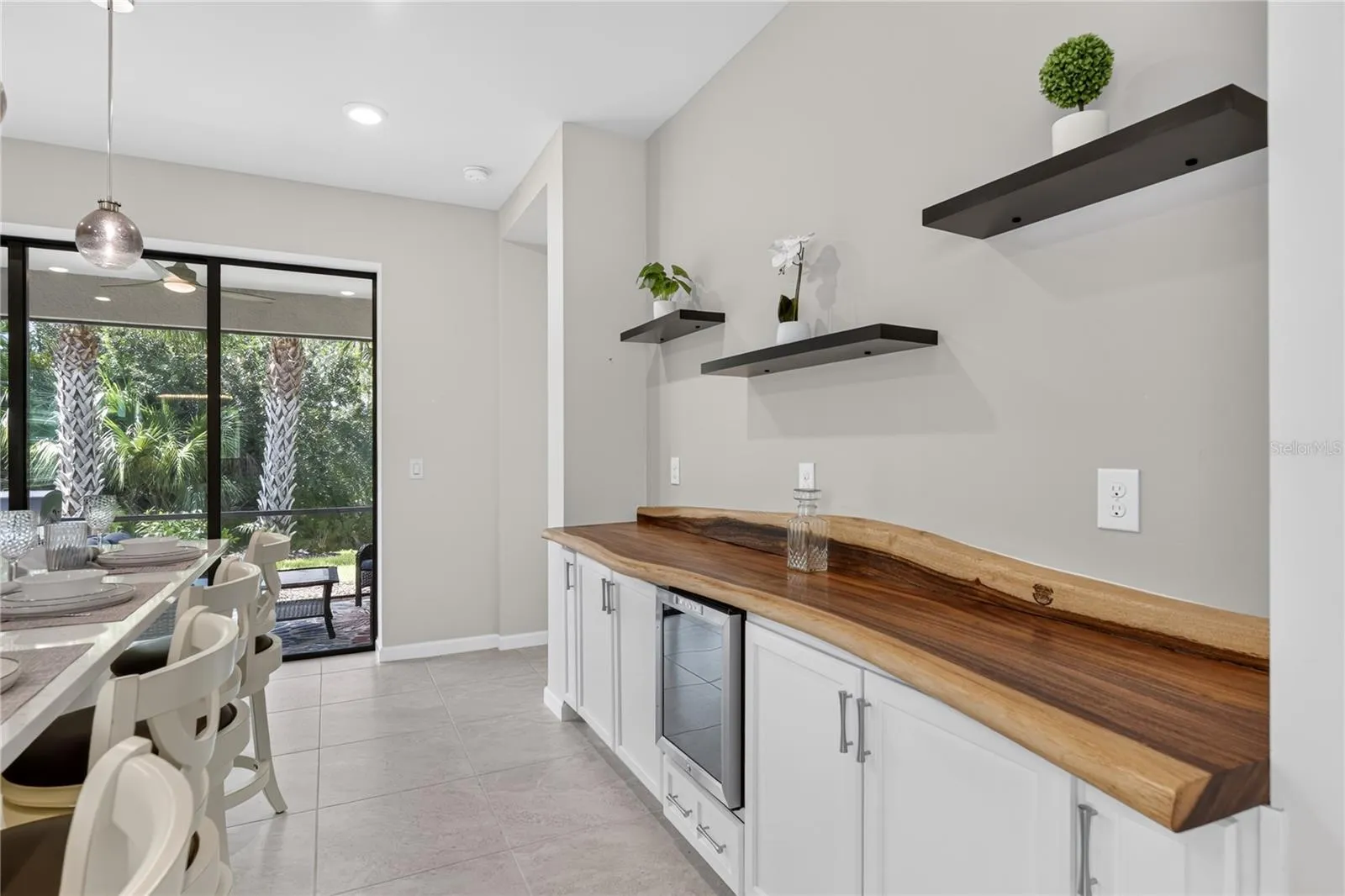 Kitchen w/wine Fridge and live edge counter