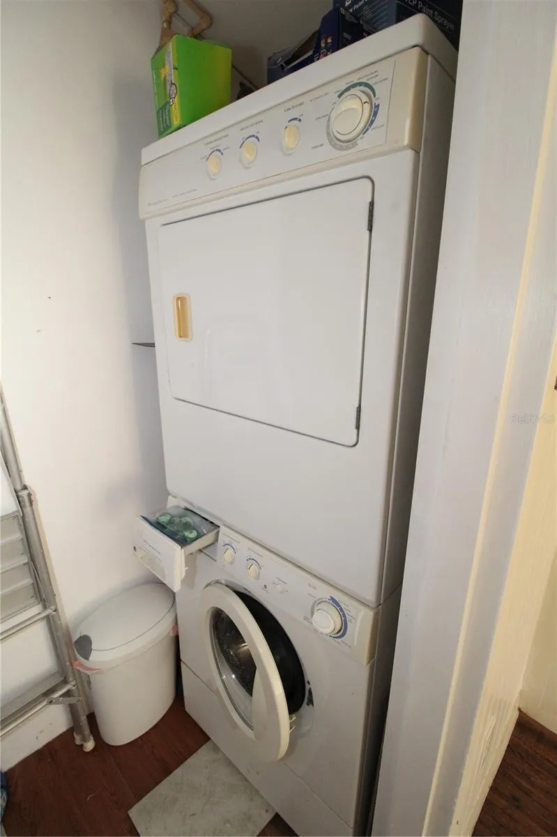 The laundry room includes stacked washer and dryer, located on the enclosed lanai.