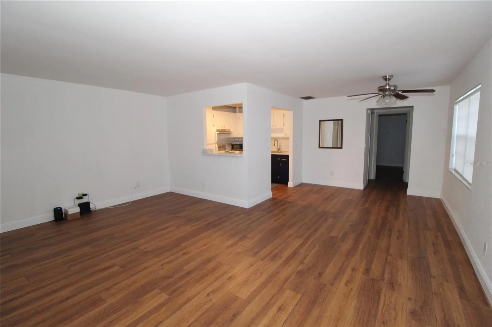 From front entrance, living and dining areas.  Convenient pass through window from the kitchen.