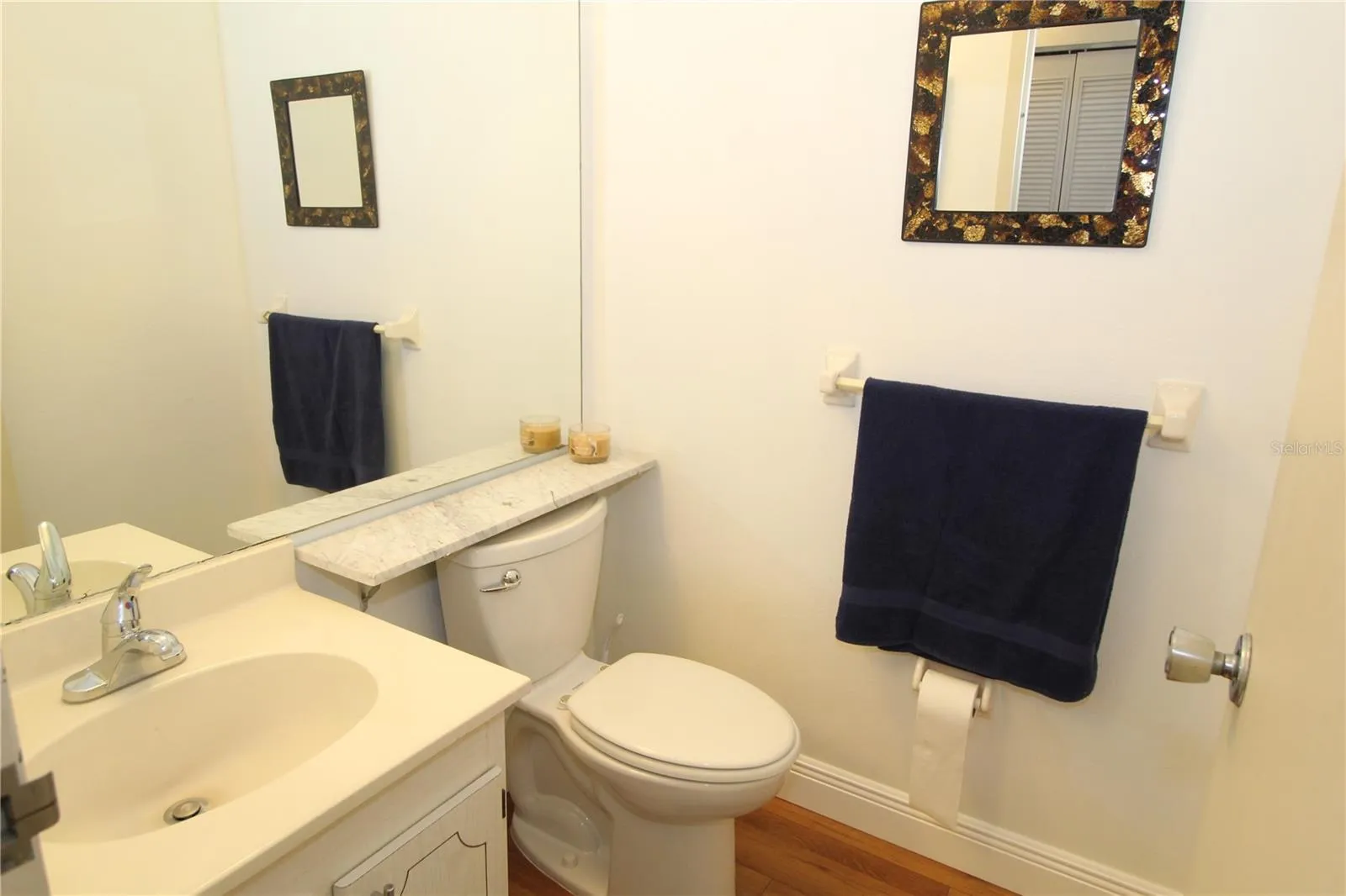 Guest half bath, pretty and bright.
