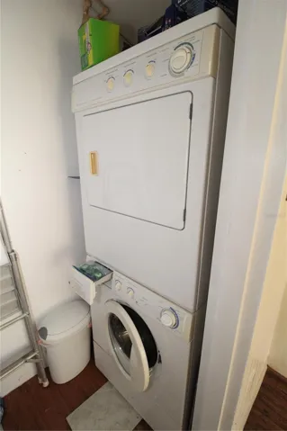 The laundry room includes stacked washer and dryer, located on the enclosed lanai.