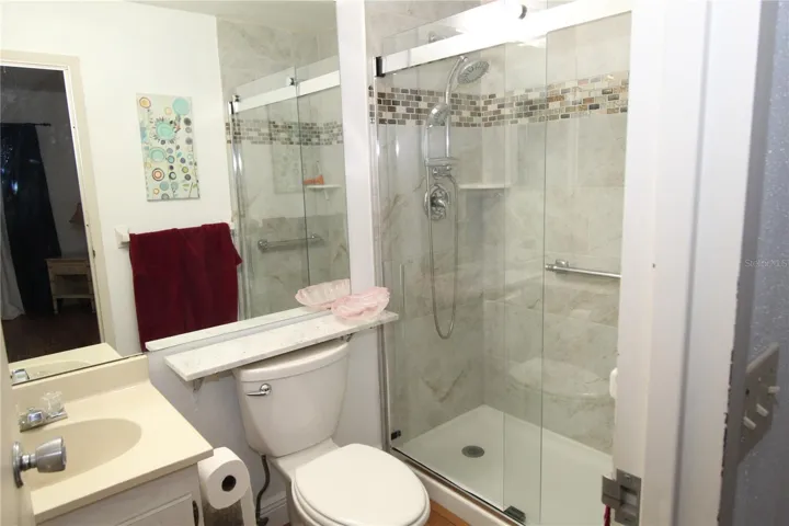 Primary bathroom with step in shower.