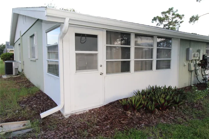 Back of the home, your enclosed lanai leads outside.